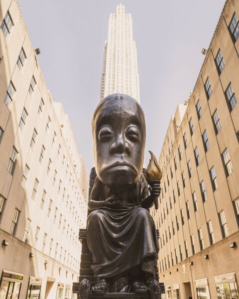 “Oracle,” a 25-foot-tall bronze statue, is one of more than 100 works by Sanford Biggers on display at Rockefeller Center. “It’s the first time we’ve invited an artist to take over the entire campus,” an official of the company that owns the center said.